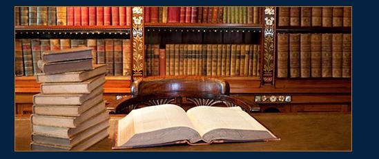 Law library with open book and bookshelves